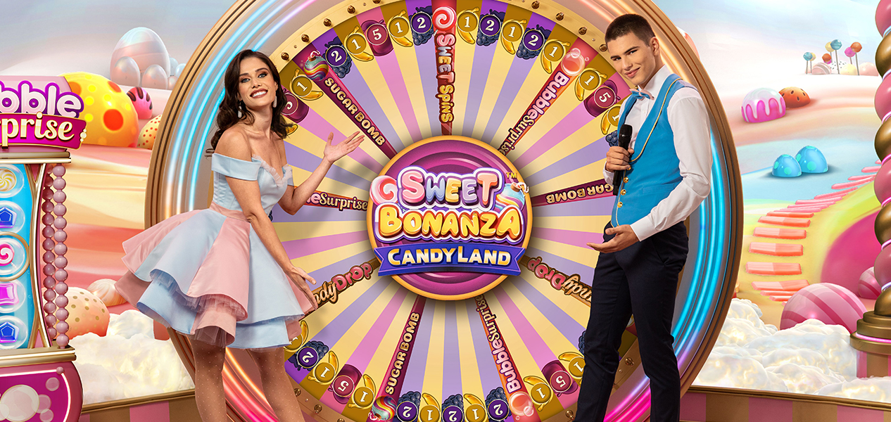 Pragmatic Play promotional image of Sweet Bonanza CandyLand with two presenters beside its colourful game-show wheel